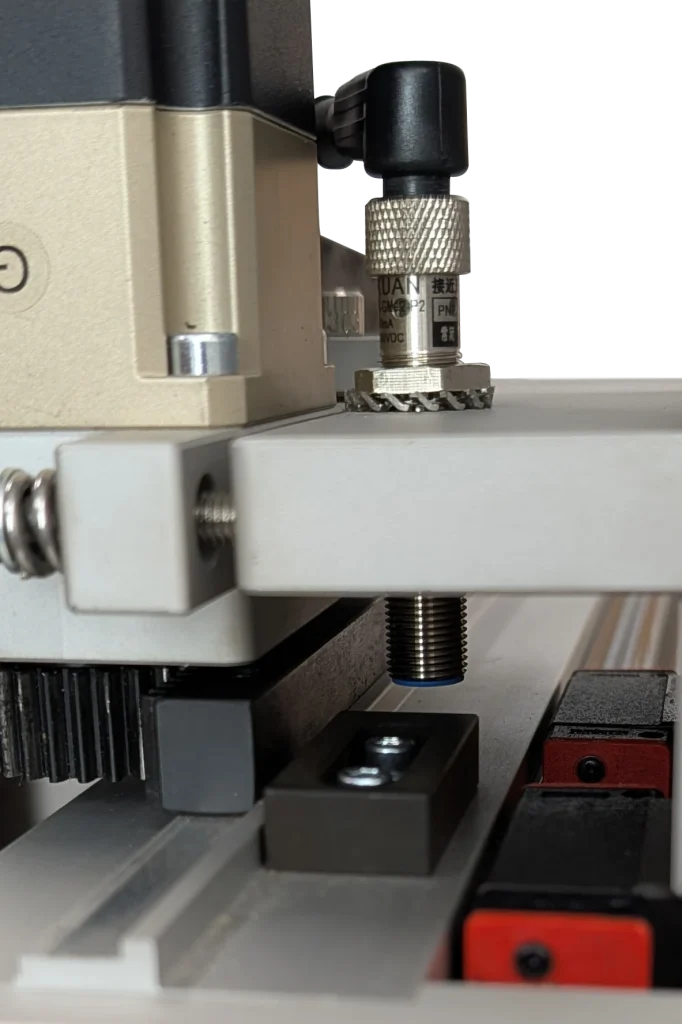Inductive proximity sensor mounted on CNC frame